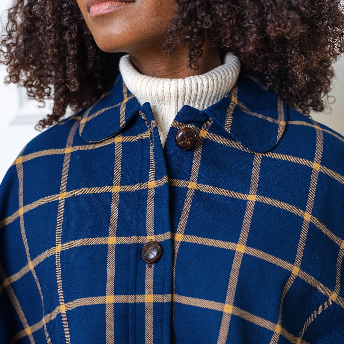 Women's Woven Cape with Button Front