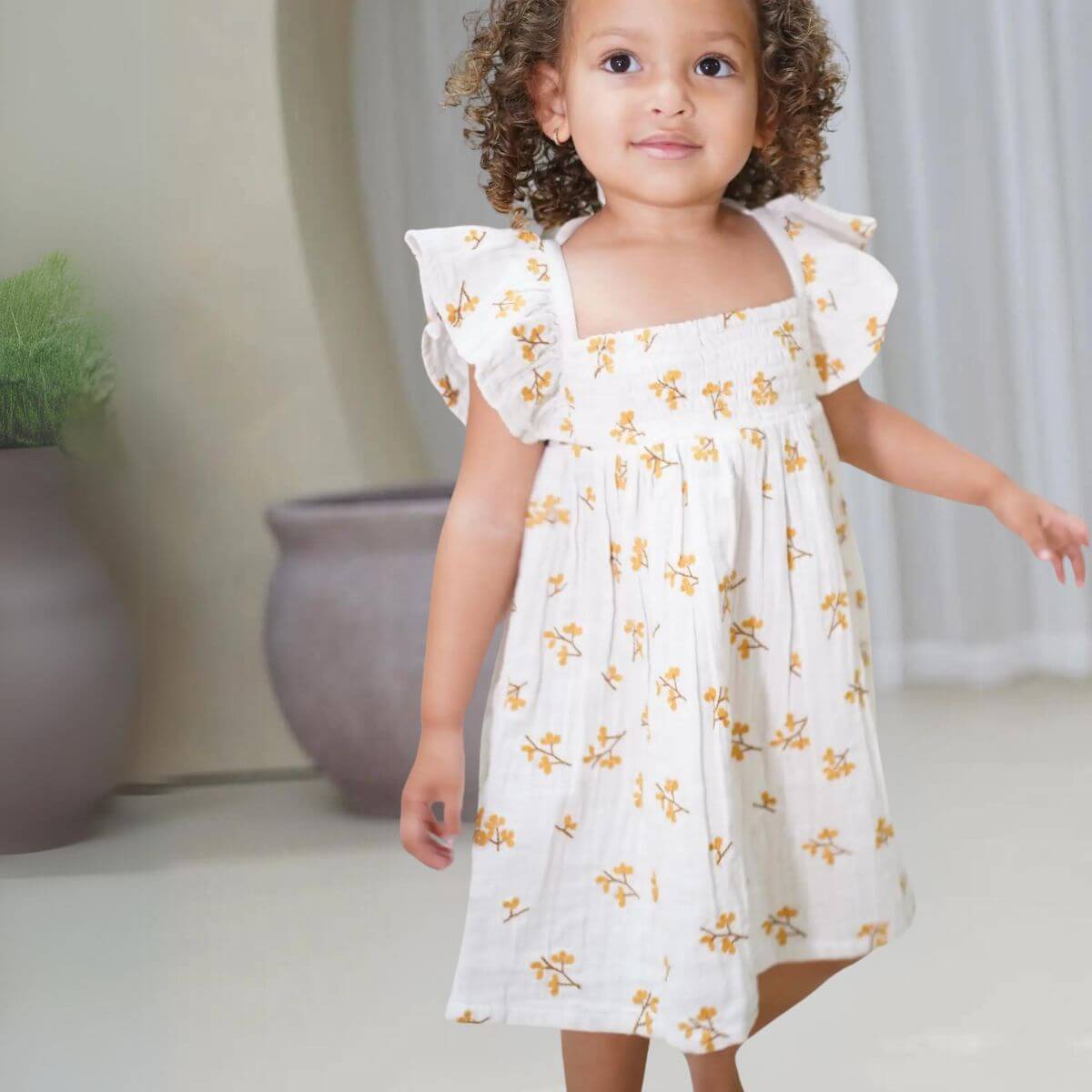 Haven Organic Baby / Toddler Floral Dress - Ecru Front view on Model