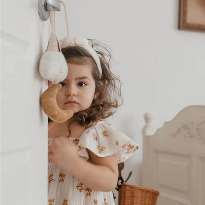 Haven Organic Baby / Toddler Floral Dress - Ecru Model in Nursery